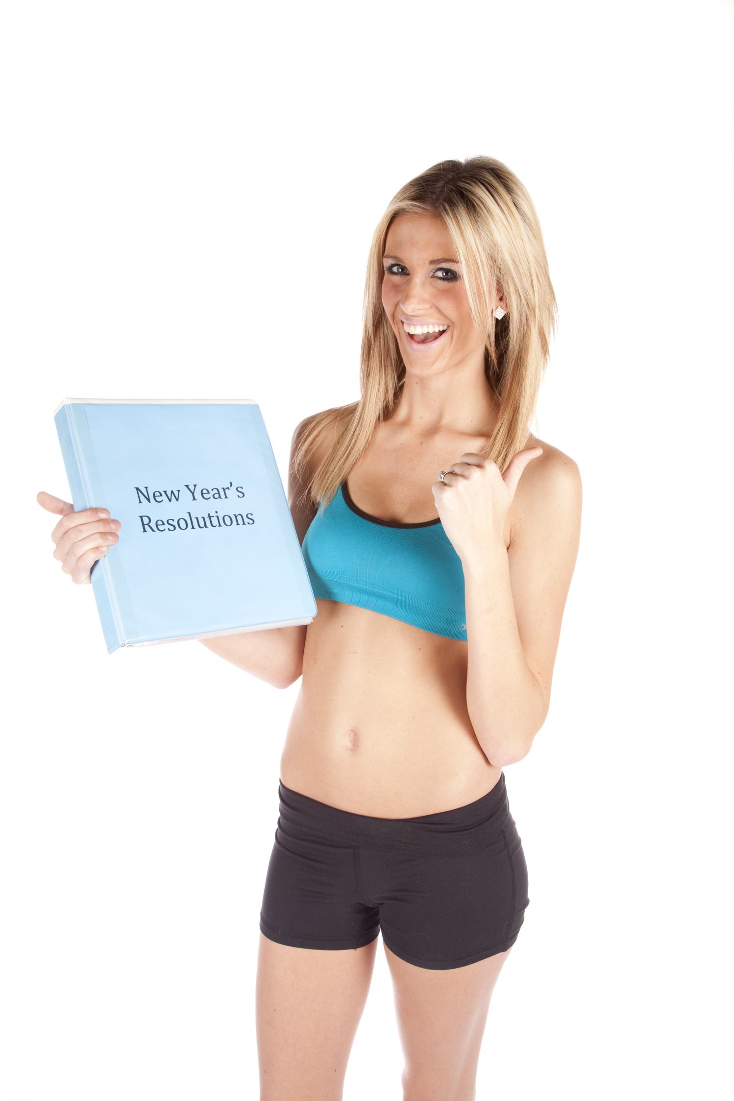 A woman holding a New Year's Resolutions book and her resolution is weight loss